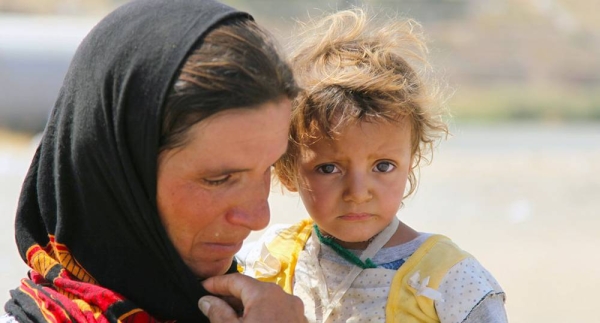 Yazidis who fled Sinjar Mountain re-enter Iraq from the Syrian Arab Republic. (file). — courtesy UNICEF/Khuzaie