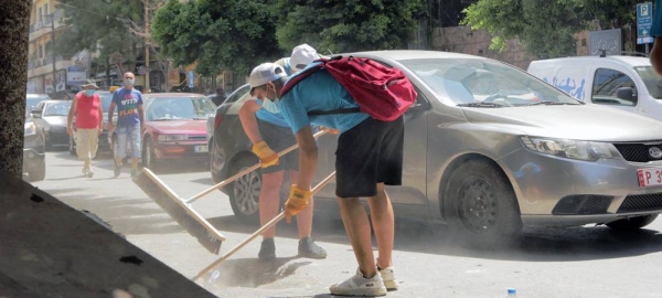 UNICEF youth network volunteers clean up Mar Mikhael after the port explosions. — courtesy UNICEF/Toya Masri
