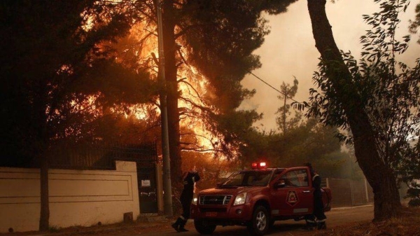 The massive blaze, now on its fourth day, has devastated 20 kilometers of forest area, destroyed several houses and shrouded Athens in the acrid smell and smoke of the fire. — Courtesy photo