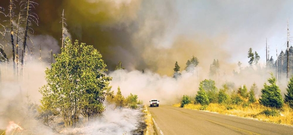 A wildfire burns in a national park in Oregon, USA. — courtesy Unsplash/Marcus Kauffman