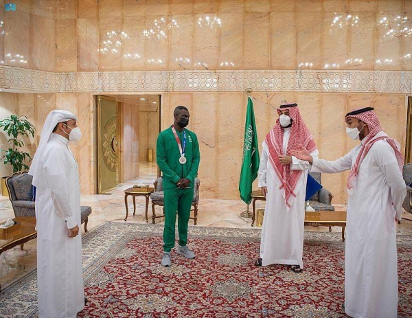  Crown Prince Muhammad Bin Salman, deputy premier and minister of defense, met on Tuesday with Saudi karate champion Tariq Hamdi, who won the silver medal for the Kingdom in the recently concluded Tokyo 2020 Olympics.