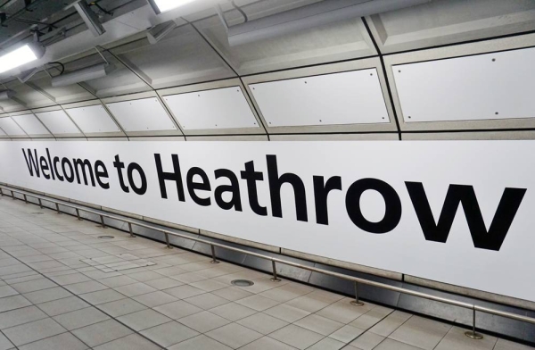 View of a sign saying Welcome to Heathrow in a tunnel at London Heathrow Airport (LHR) in London.