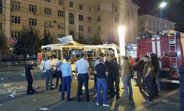 
Police and investigators work at a site of an explosion on a city bus in Voronezh, about 450 kilometers (280 miles) south of Moscow, Russia, Thursday.