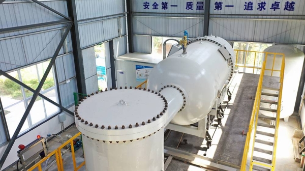 A technician operates the electron accelerator, which produces high energy electron beams to react with DNA/RNA molecules or cells of microorganisms. — courtesy China Atomic Energy Authority