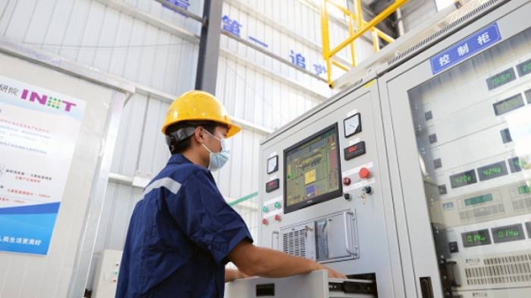 A technician operates the electron accelerator, which produces high energy electron beams to react with DNA/RNA molecules or cells of microorganisms. — courtesy China Atomic Energy Authority