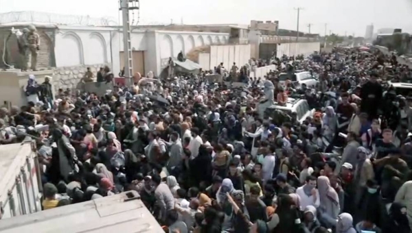 US marines provide assistance during an evacuation at Hamid Karzai International Airport in Kabul, Afghanistan, Friday.