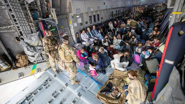 US marines provide assistance during an evacuation at Hamid Karzai International Airport in Kabul, Afghanistan, Friday.