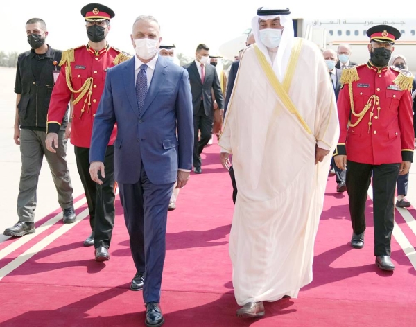 Kuwait Prime Minister Sheikh Sabah Khaled Al-Hamad Al-Sabah greets his Iraqi counterpart Mustafa Al-Kadhemi at the airport.