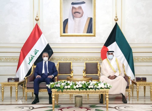 Kuwait Prime Minister Sheikh Sabah Khaled Al-Hamad Al-Sabah greets his Iraqi counterpart Mustafa Al-Kadhemi at the airport.