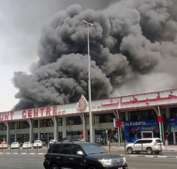 Videograb of plumes of black smoke darkening the sky following a fire at a warehouse in the Dubai area.