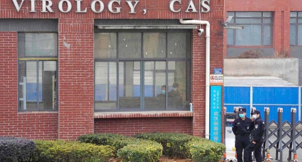 File photo shows security personnel near the entrance of the Wuhan Institute of Virology during a visit by the World Health Organization team in Wuhan, China, Feb. 3, 2021.