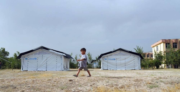 A child walks through a temporary camp set up in Kabul after his family was displaced due to insecurity across Afghanistan. — courtesy UNICEF Afghanistan