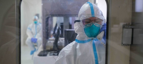 Medical technicians test the equipment inside a sterile lab during the inauguration of a new facility in the Philippines focused on pandemic research. — courtesy ADB/Veejay Villafranca