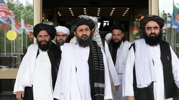 Veteran Taliban member Mullah Mohammad Hassan Akhund, center, has been named as interim prime minister in a caretaker government on Tuesday.