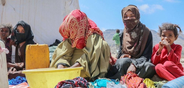 An elderly woman drags water back to her tent in a displacement camp in Abs, near the Saudi border in northern Yemen. — courtesy UNOCHA/Giles Clarke