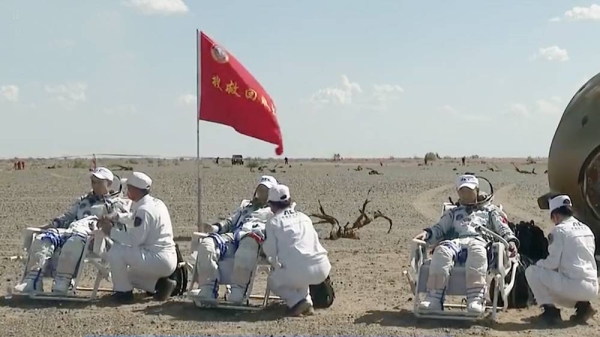The three taikonauts from China's Shenzhou-12 manned spaceflight mission made their first appearance out of the re-entry capsule after safely landing back on Earth local time on Friday afternoon.