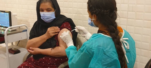 An Afghan refugee is vaccinated against Covid-19 in Rawalpindi, Pakistan.