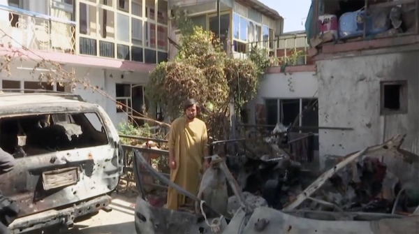An Afghan inspects the damage of Ahmadi family house in Kabul, Afghanistan after the Aug, 28 drone strike.
