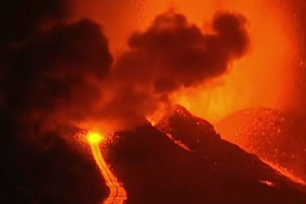 The volcano that erupted on the Spanish Canary Island of La Palma on Sunday, sent lava shooting into the air and streaming in rivers toward houses in two villages in the south of the island.