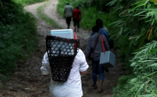 Covid vaccinators helping to protect remote Indian villages.