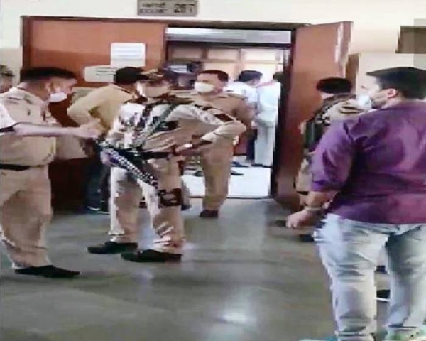 Videograb of a shootout between police and gangsters at the New Delhi court is ongoing on Friday.
