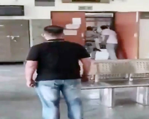 Videograb of a shootout between police and gangsters at the New Delhi court is ongoing on Friday.