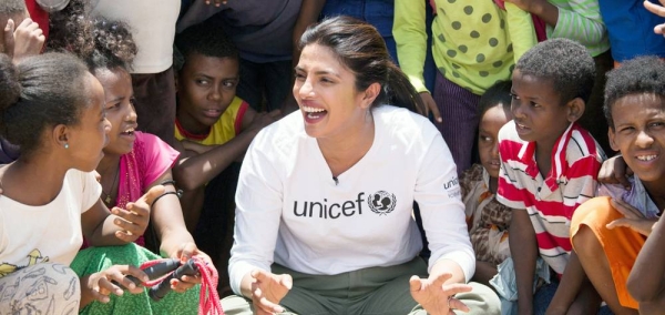 UNICEF Goodwill Ambassador Angelique Kidjo engages with children in the Housh el Refka informal settlement, in Lebanon's Bekaa Valley. — courtesy UNICEF/Diego Ibarra Sanchez