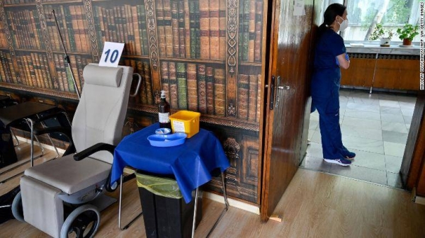 A healthcare worker is waiting for patients at a Covid-19 vaccination centre at The Military Medical Academy in Sofia.