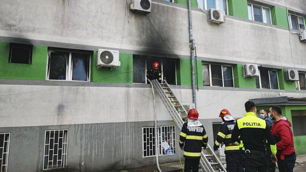 Firefighters put out a blaze at the COVID-19 ICU section of the Hospital for Infectious Diseases in the Black Sea port of Constanta, Romania, Friday.