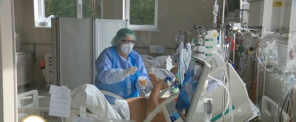 Medical personnel give assistance to a Covid-19 patient inside the mobile intensive care unit of the Pneumophysiology Institute in Bucharest.