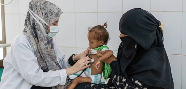 A mother in Yemen takes her 18-month-old daughter to be treated for malnutrition. — courtesy UNICEF/Saleh Hayyan