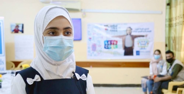 A girl student in Basra, Iraq, who benefits from a UNICEF/WFP education stipend program. — courtesy UNICEF