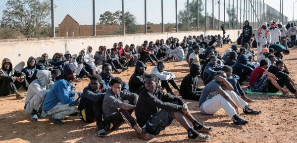 File photo shows migrants sitting in the courtyard of a detention center in Libya. — courtesy UNICEF/Alessio Romenzi