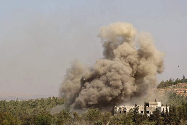 In this file photo, smoke billows following an airstrike in the Syrian province of Idlib on Sept. 20, 2020.