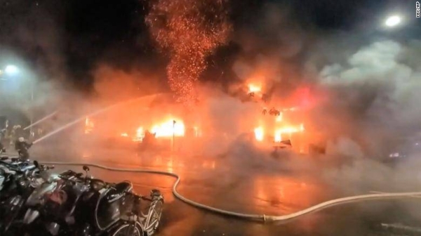 Firefighters battle a blaze at a building in Kaohsiung, in southern Taiwan on October 14. 
