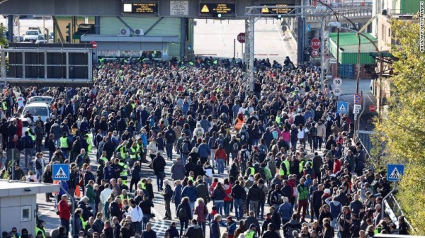 Dockers and other workers gather for a protest in the port of Trieste on October 15, 2021 as new Green Pass requirements come into force.