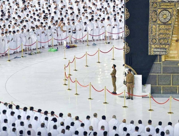 A Muslim boy performs Al-Fajr prayer Sunday at the Grand Mosque amid atmosphere full of faith.