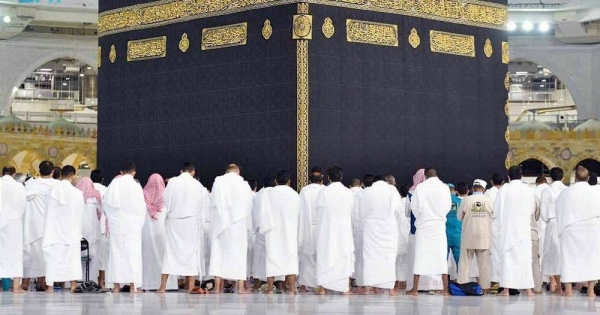 A Muslim boy performs Al-Fajr prayer Sunday at the Grand Mosque amid atmosphere full of faith.