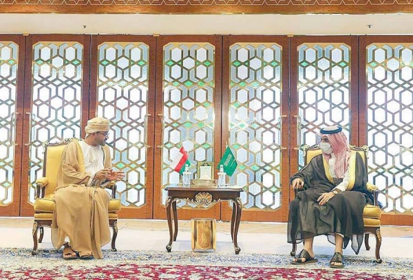 Prince Faisal Bin Farhan, Minister of Foreign Affairs, being handed the letter Monday by Omani Foreign Minister Sayyid Badr Bin Hamad Bin Hamoud Al-Busaidi during a meeting Monday.