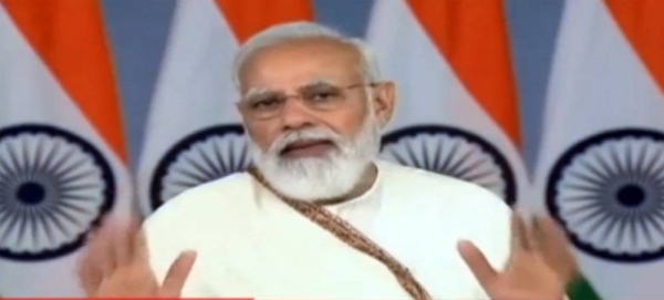 Indian Prime Minister Narendra Modi announcing the 1 billion dose milestone at RML Hospital in New Delhi on Thursday.