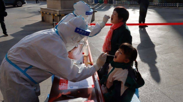 Residents undergoing nucleic acid tests for the Covid-19 coronavirus in Zhangye in China's northwestern Gansu province.