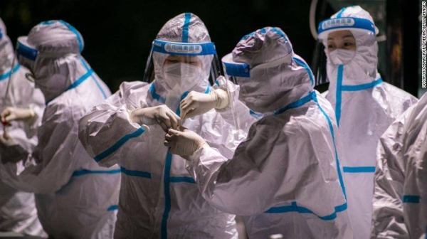 Medical workers working on the samples of Covid-19 nucleic acid test at a testing site in Hohhot, China's Inner Mongolia Autonomous Region, on October 24.