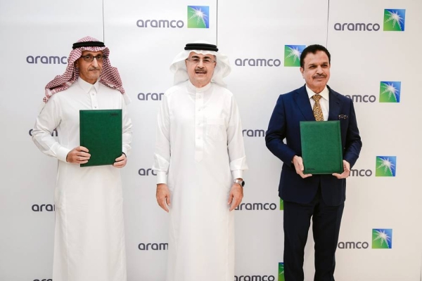 Aramco President and CEO Amin H. Nasser, center, over sees the MoUs signed by Aramco Tuesday as it plans to expand its focus on emerging sectors to drive private sector innovation and investment.