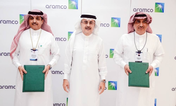 Aramco President and CEO Amin H. Nasser, center, over sees the MoUs signed by Aramco Tuesday as it plans to expand its focus on emerging sectors to drive private sector innovation and investment.