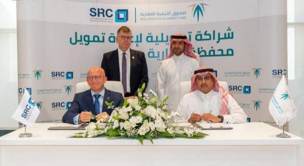 REDF CEO Mansour bin Madi and SRC CEO Fabrice Susini signed an agreement in the presence of Minister of Municipal and Rural Affairs and Housing and Chairman of the Board of Directors of REDF Majid Bin Abdullah Al-Hogail.