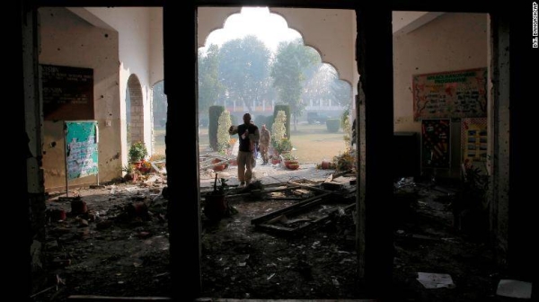 A file photo shows a Pakistan army soldier inspecting the Army Public School that was attacked by militants in Peshawar on December 17, 2014.