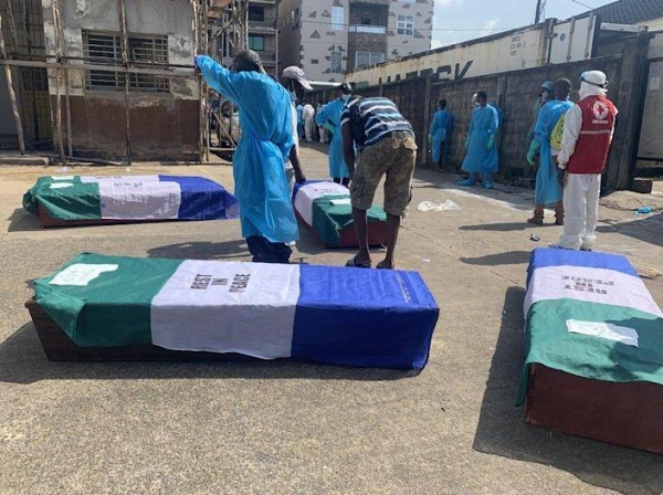 Coffins for the dead were draped in the national flag with the words 