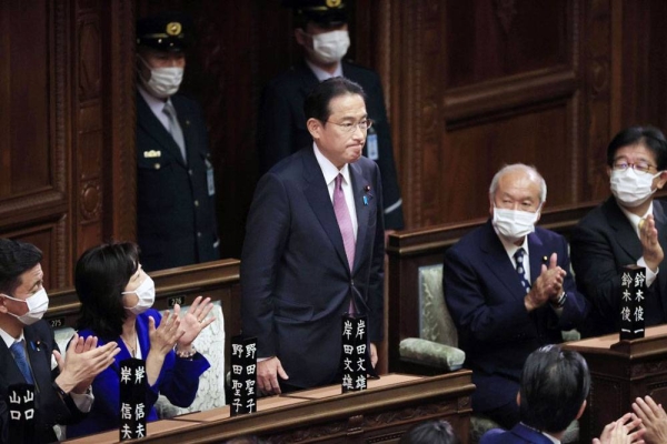 Fumio Kishida (C) stands up after being re-elected Japanese prime minister in a House of Representatives plenary session on Wednesday in Tokyo. — courtesy Kyodo