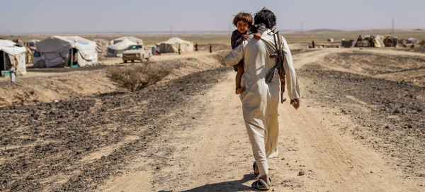 A displaced man who fled his village now lives in a tent settlement on the outskirts of Marib in Yemen.