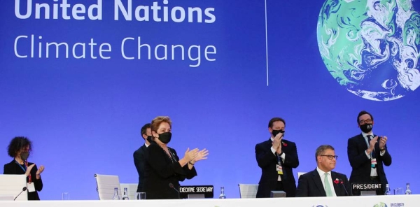 Negotiators marking the closing of the United Nations climate summit, COP26, which opened in Glasgow, Scotland, on Oct. 31. The conference sought new global commitments to tackle climate change. — courtesy UN News/Laura Quiñones